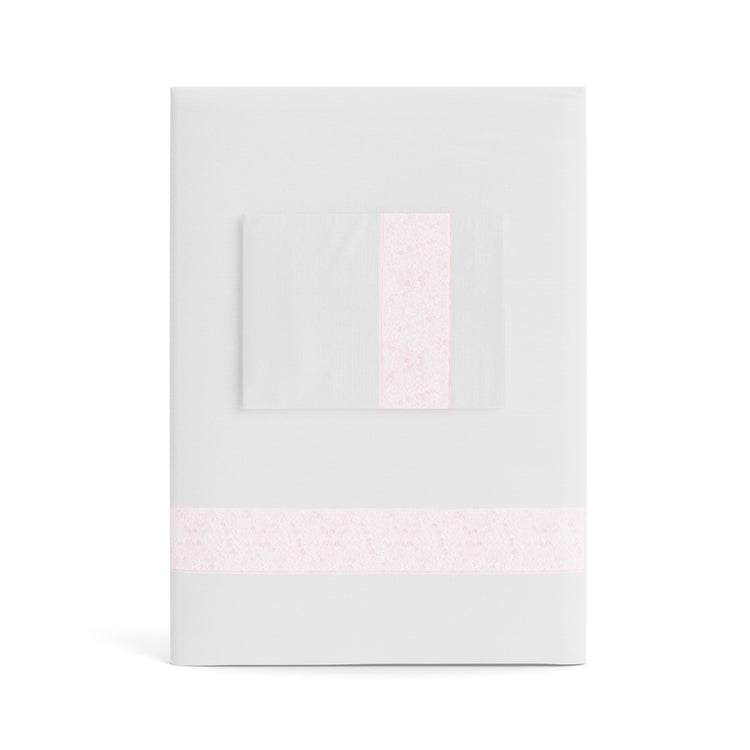 A folded white Minaudiere Sheet Set by Judith Leiber Couture x Ann Gish, shown with its matching pillowcase on top, featuring a light pink sequenced border band that mirrors the jeweled sparkle of the Minaudiere design. - SSMIK-WHI-PIN SSMIQ-WHI-PIN
