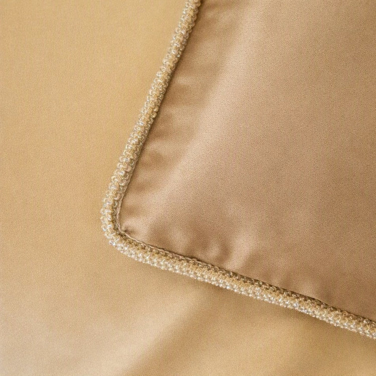 Close-up of a brown silk fabric corner with a decorative border of small iridescent pearls and clear rhinestones on top of pumice silk fabric. - SHMOE-MYS-PUM SHMOK-MYS-PUM SHMOS-MYS-PUM PWMO3616-MYS-PUM