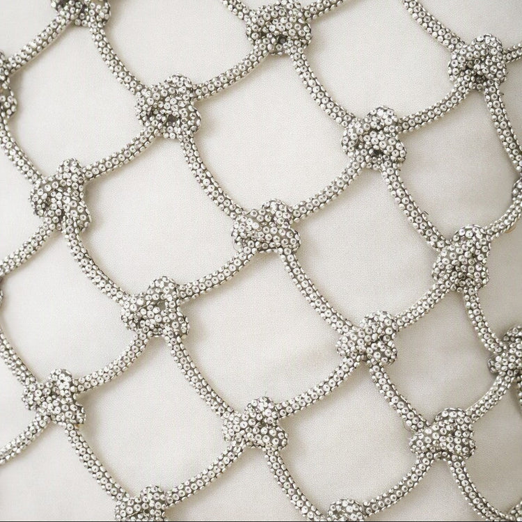 Close-up of a silver beaded mesh or net pattern with repeating diamond shapes and floral knot details on an ivory silk fabric background. - PWPE1812-IVO PWPE2222-IVO