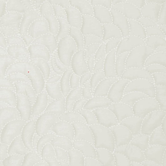 Swatch of the Shells Coverlet Set in Bone from the Judith Leiber Couture by Ann Gish collection, showing the scalloped quilted pattern and texture.